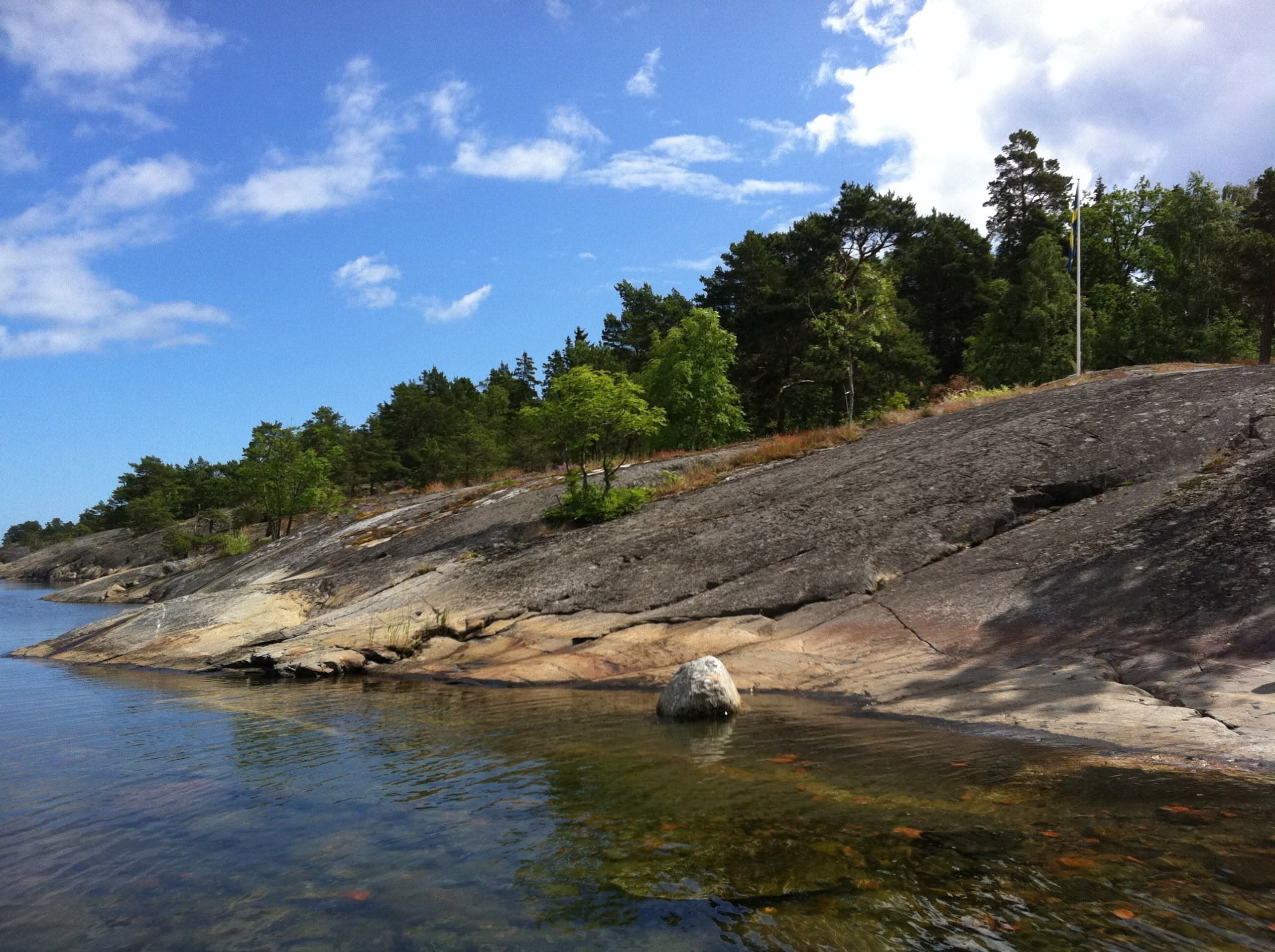 Hill and water with blue sky